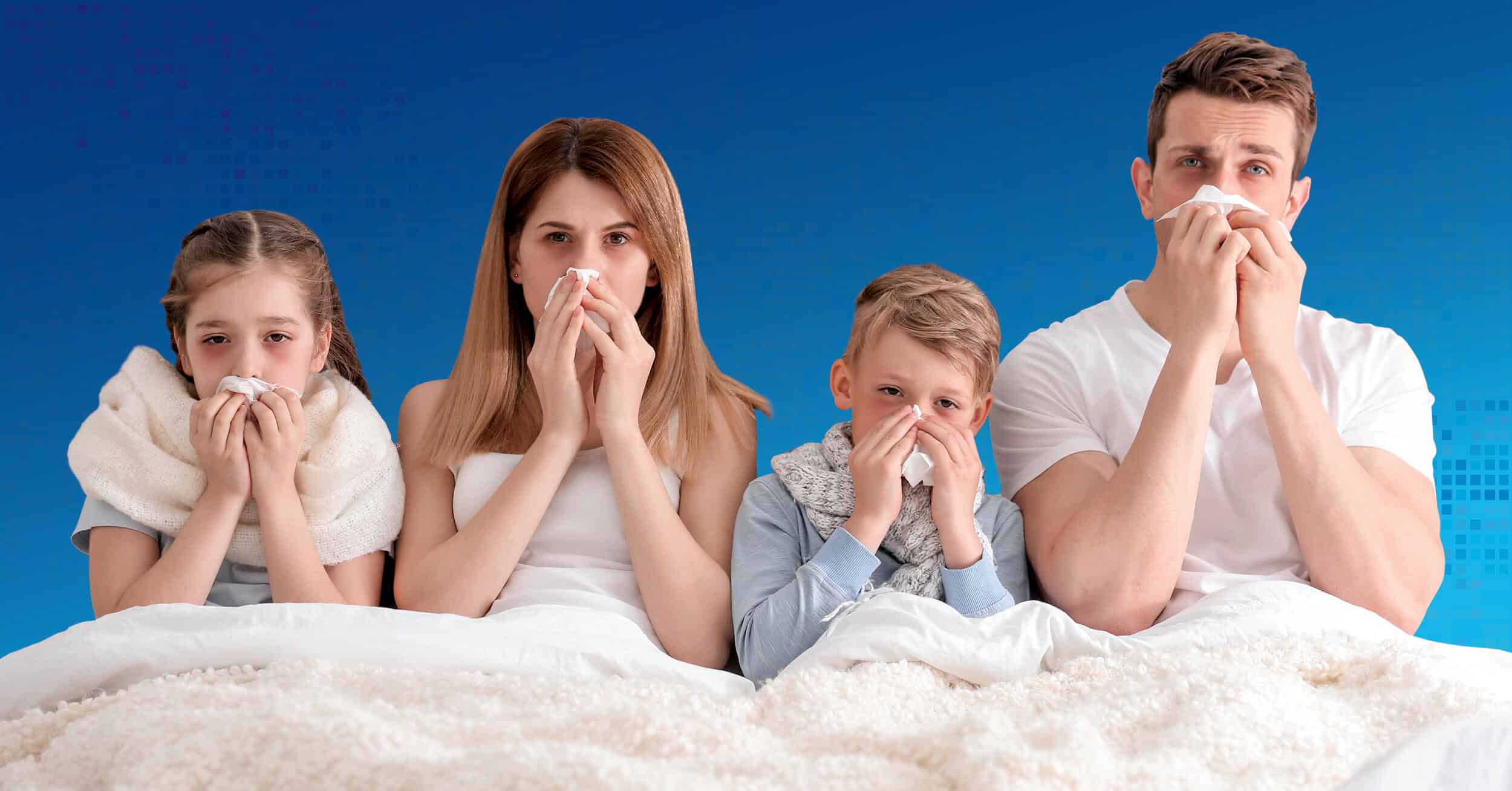 a sick family of four all blow their noses in bed