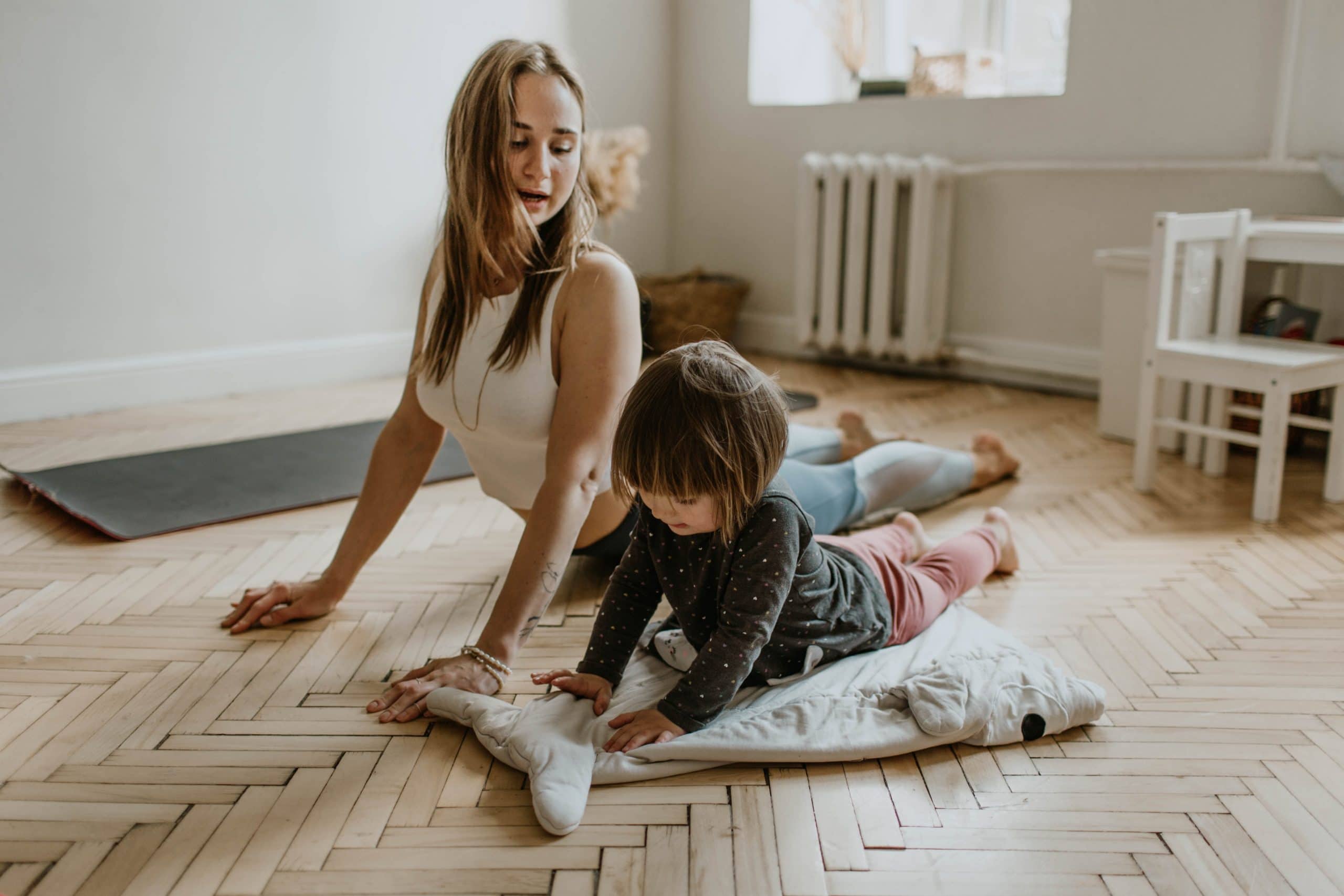 mom and child do yoga together