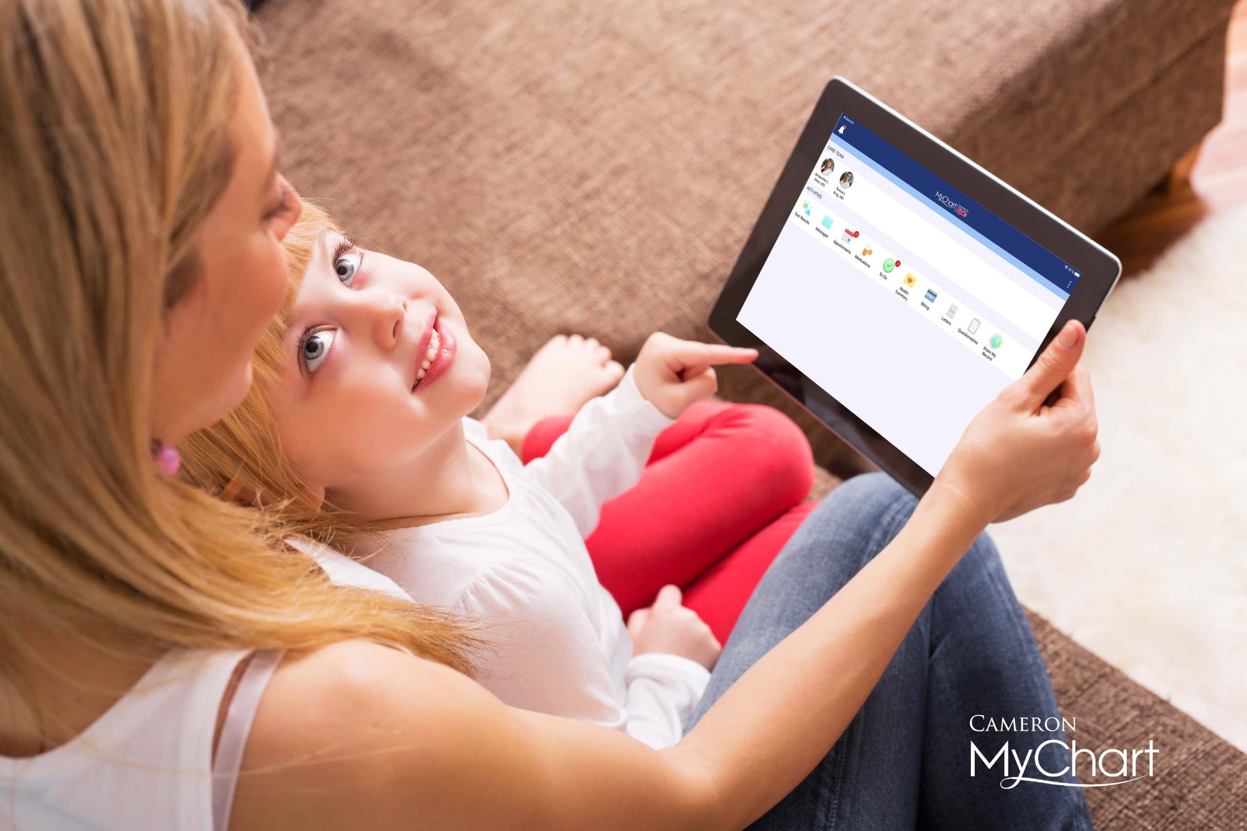 A family uses Cameron's MyChart service on a tablet