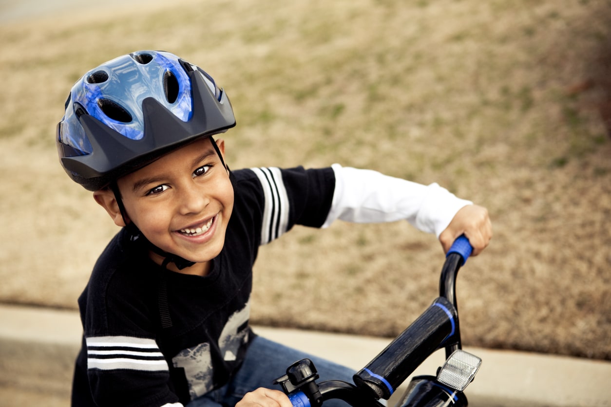 a child practicing spring safety bike tips